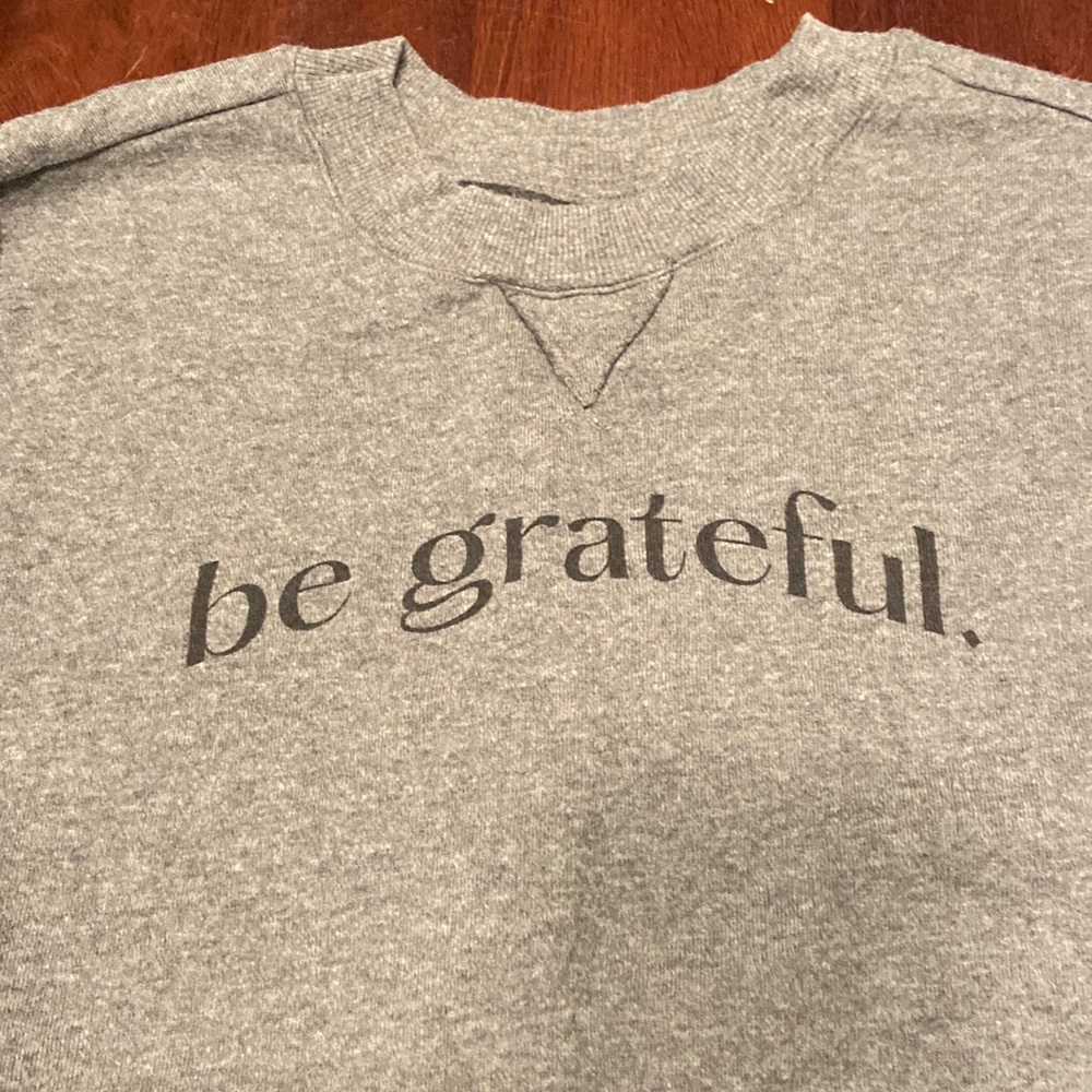 Cropped, dark gray sweatshirt